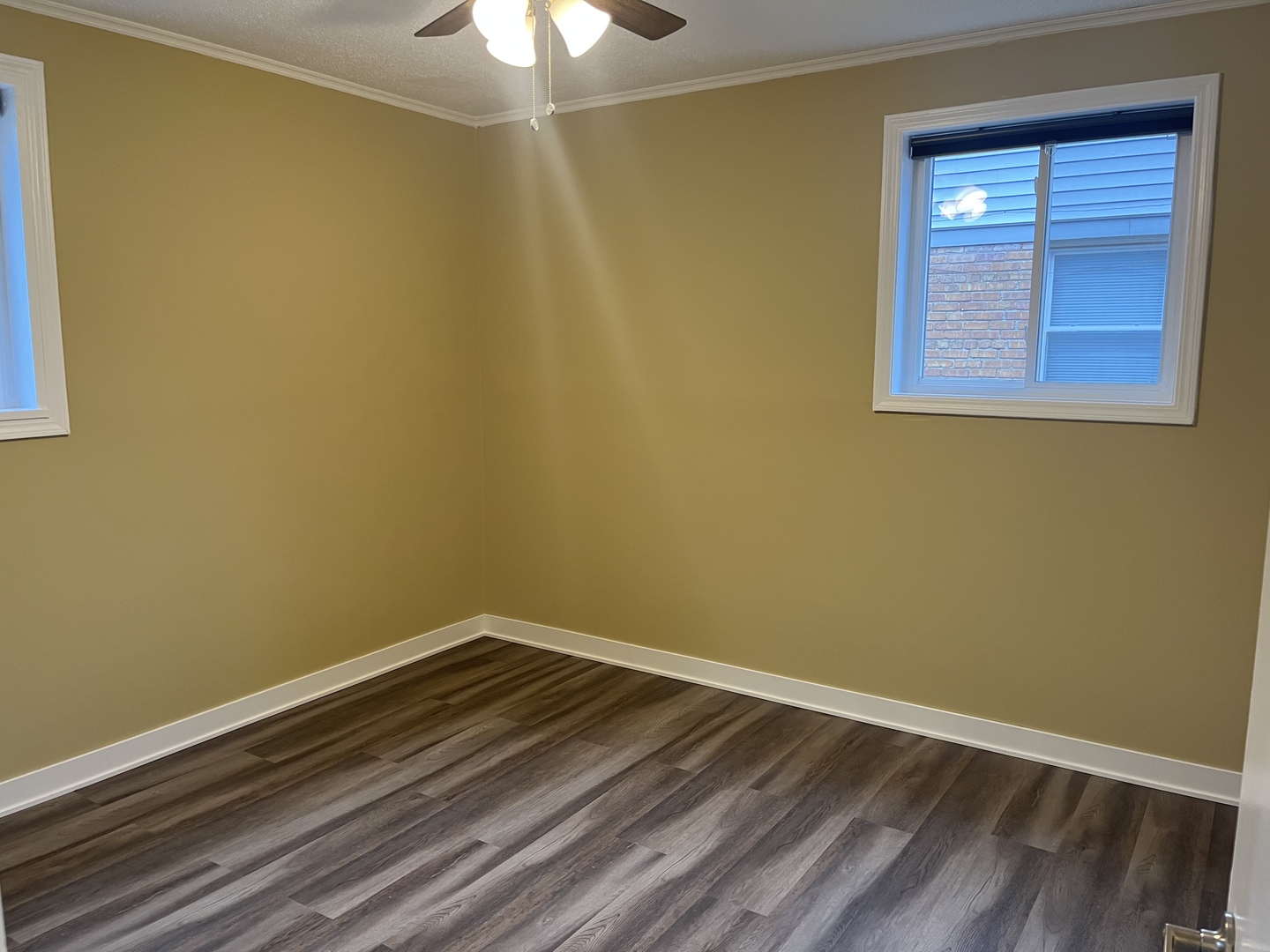 2337 175th Street Homewood, IL 60430 - Photo 6 of 12 an empty room with a wooden floor and a window
