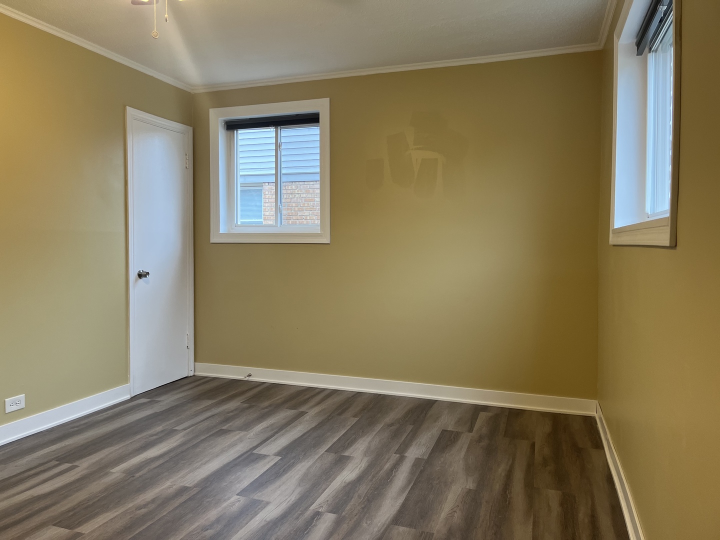 2337 175th Street Homewood, IL 60430 - Photo 7 of 12 a view of an empty room with wooden floor and a window