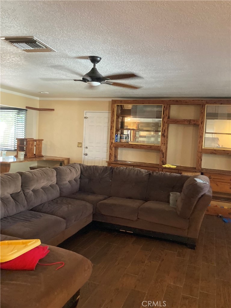 1201 Elizabeth Street Barstow, CA 92311 - Photo 2 of 19 a living room with furniture and a window