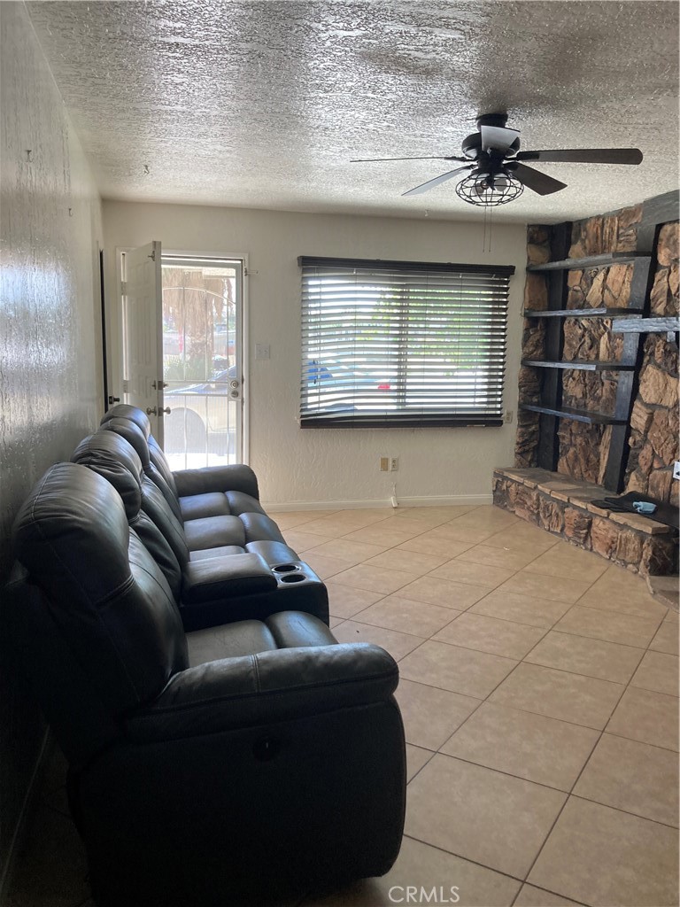 1201 Elizabeth Street Barstow, CA 92311 - Photo 3 of 19 a living room with furniture a window and appliances