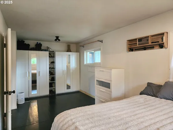 a bedroom with a bed and a view of bathroom