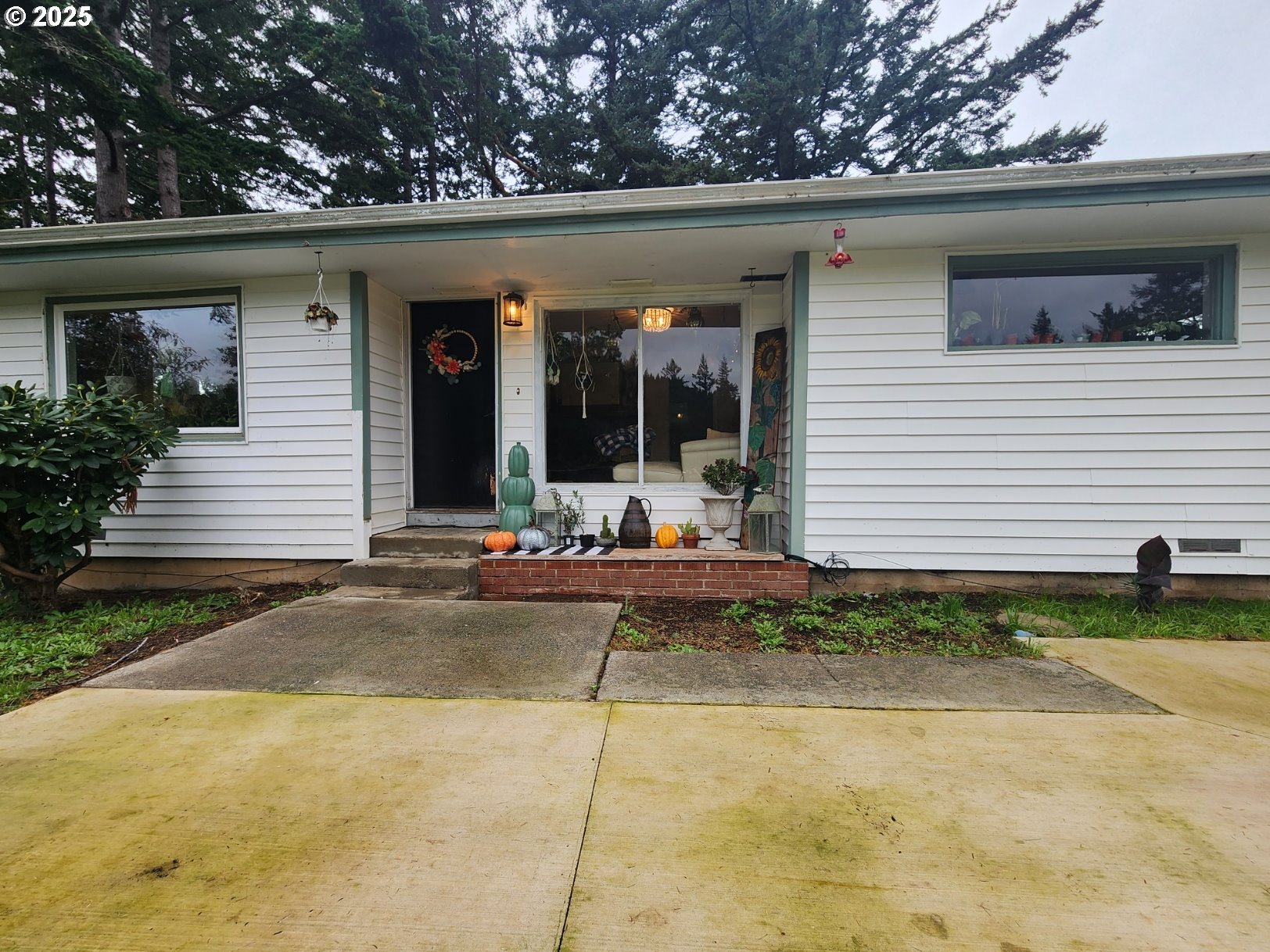 2605 Port Orford Loop Road Port Orford, OR 97465 - Photo 3 of 25 a view of a house with patio