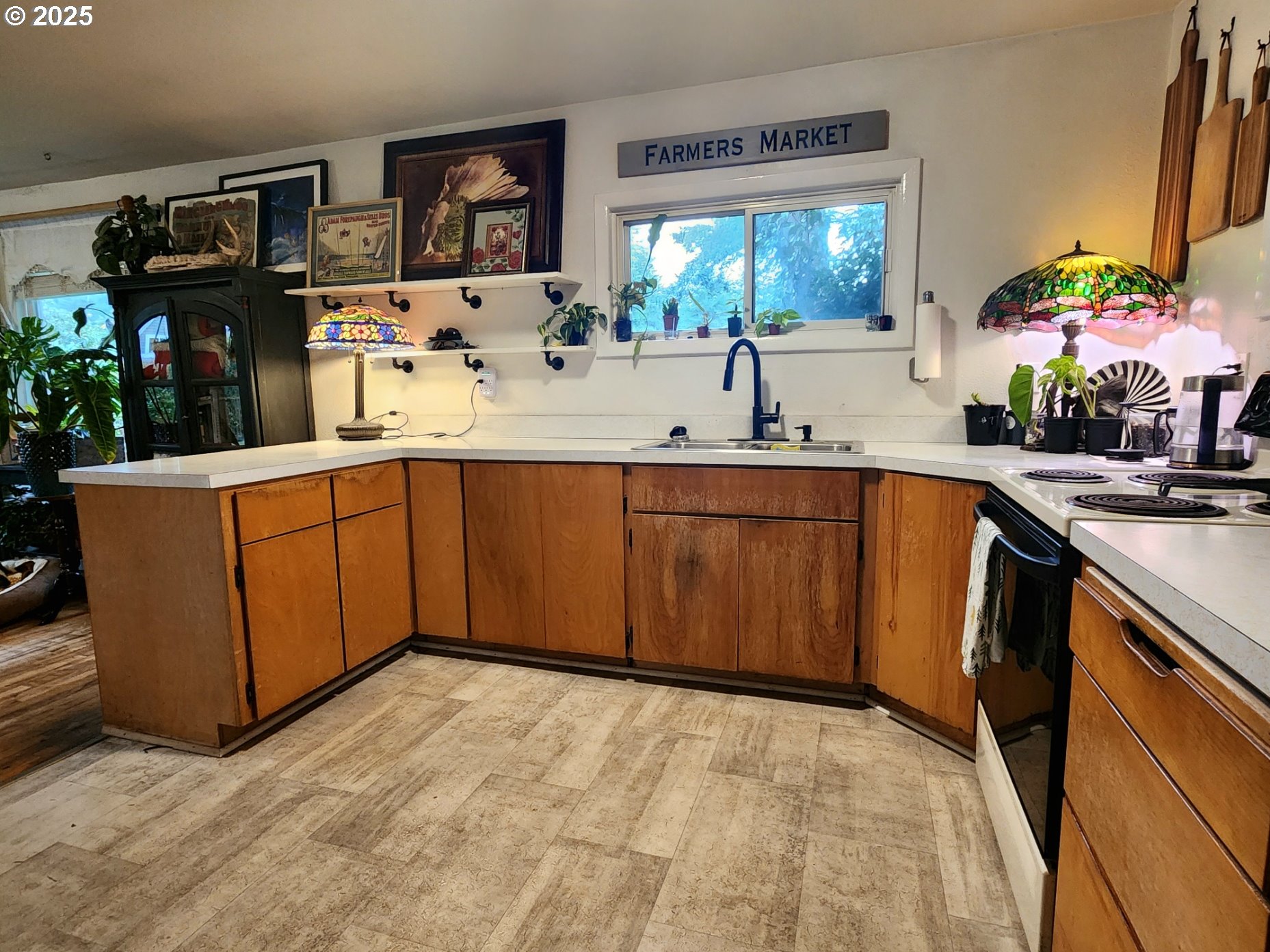 2605 Port Orford Loop Road Port Orford, OR 97465 - Photo 4 of 25 a kitchen with stainless steel appliances a sink and cabinets