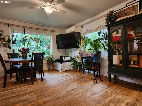 a workspace with furniture window and wooden floor