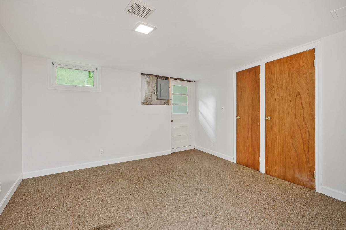 1016 Winsford Road Towson, MD 21204 - Photo 32 of 42 an empty room with windows