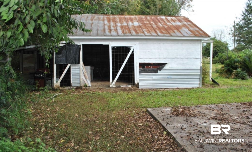 1059 Alabama Street Loxley, AL 36551 - Photo 9 of 12 View of outdoor structure featuring a yard