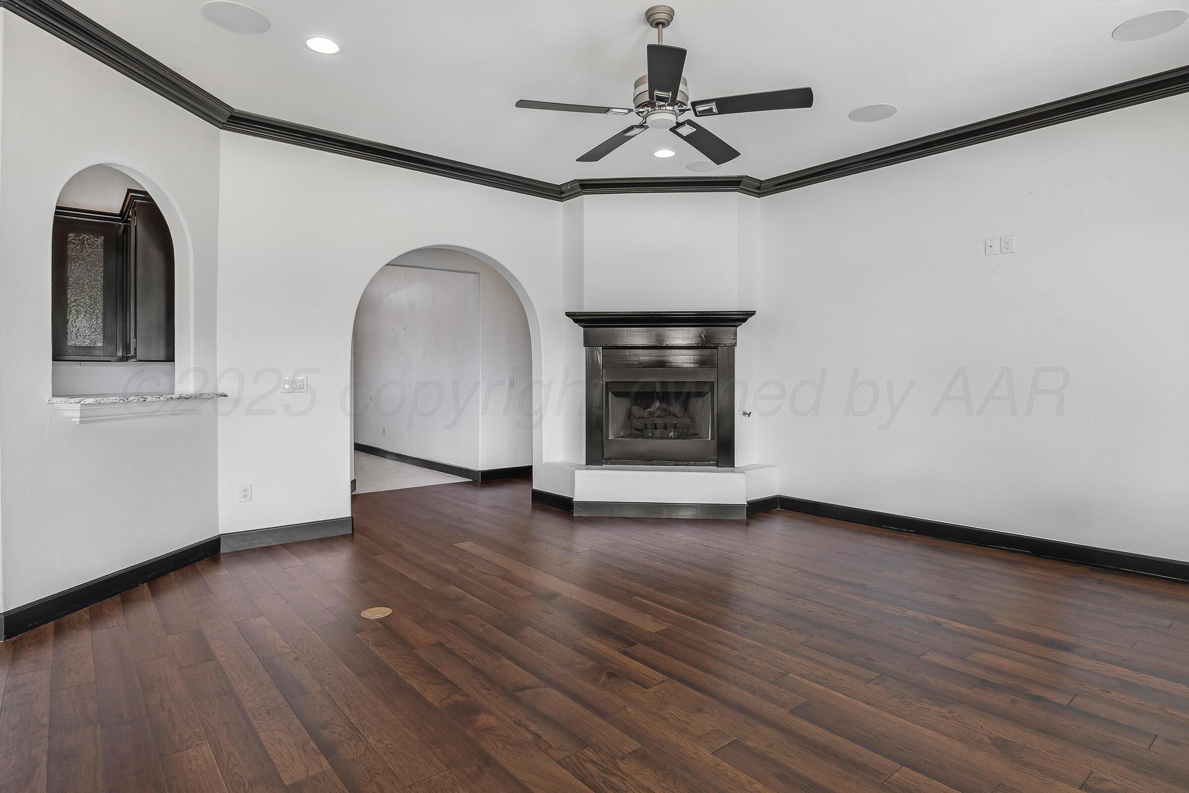 6 Merion Place Amarillo, TX 79124 - Photo 11 of 46 a view of an empty room with a window and wooden floor
