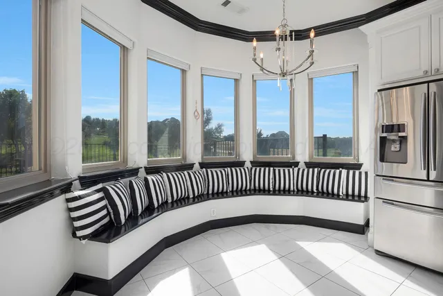 a view of entryway and balcony with furniture