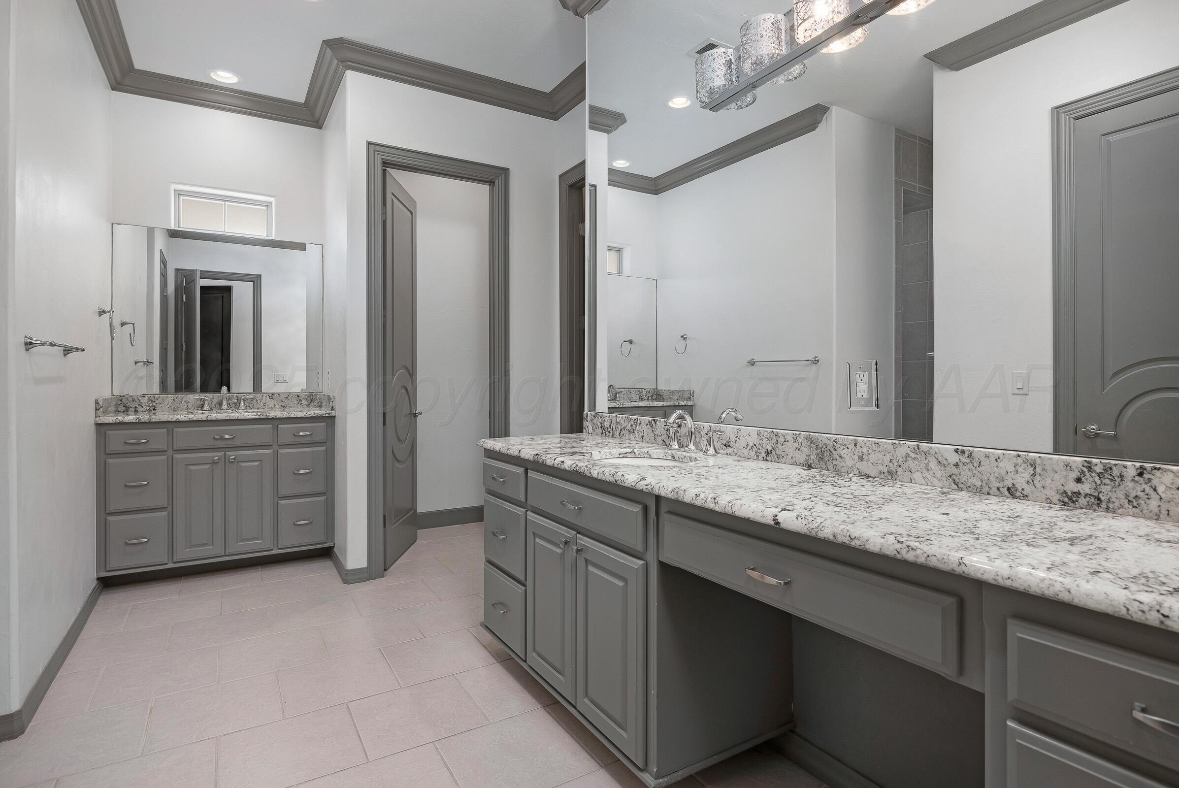 6 Merion Place Amarillo, TX 79124 - Photo 21 of 46 a bathroom with a sink and a mirror