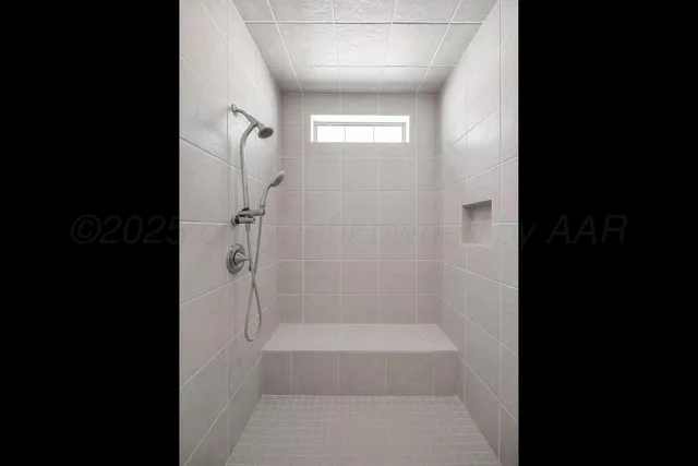 a view of walk in closet with wooden floor