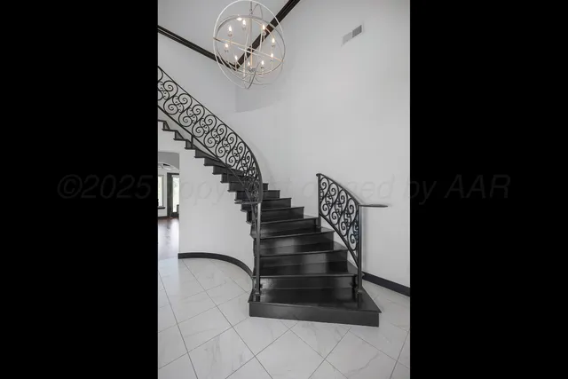 a view of an empty room with glass door and balcony