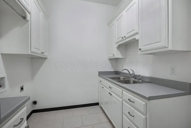 a view of front door and small yard