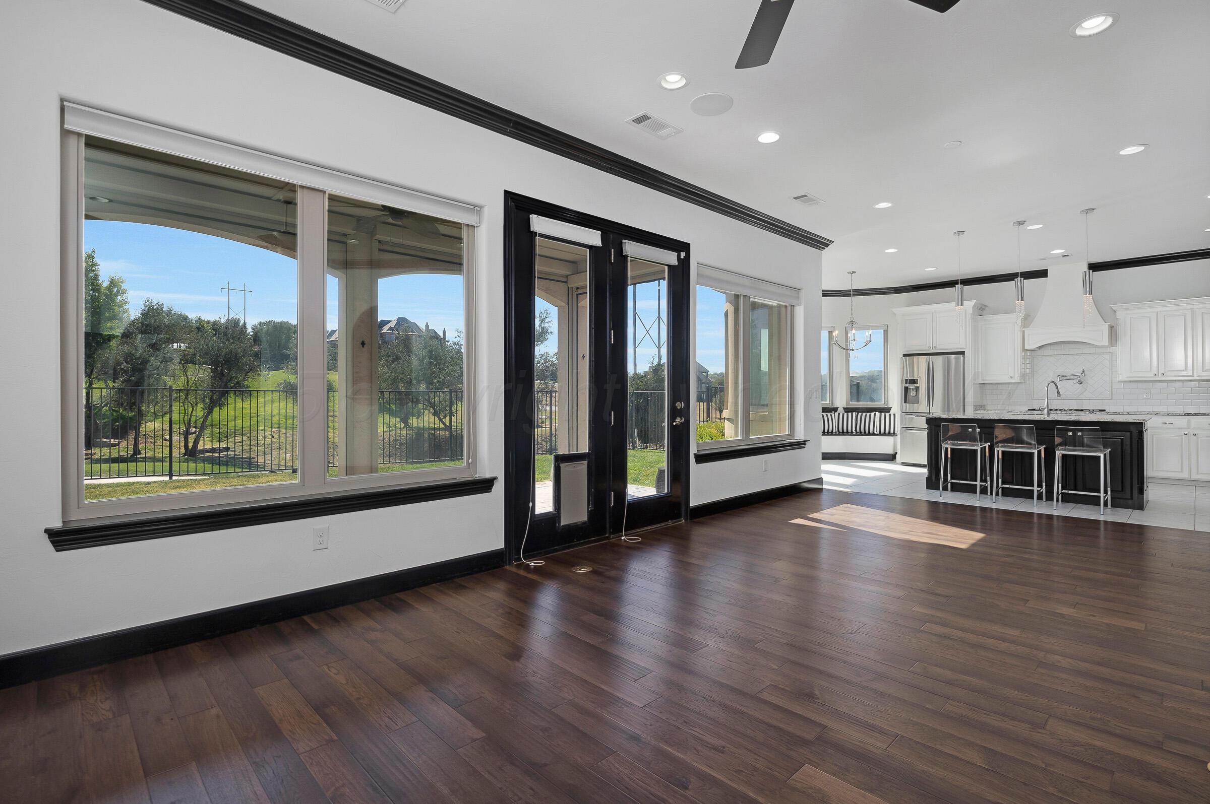 6 Merion Place Amarillo, TX 79124 - Photo 8 of 46 a view of a big room with wooden floor and windows