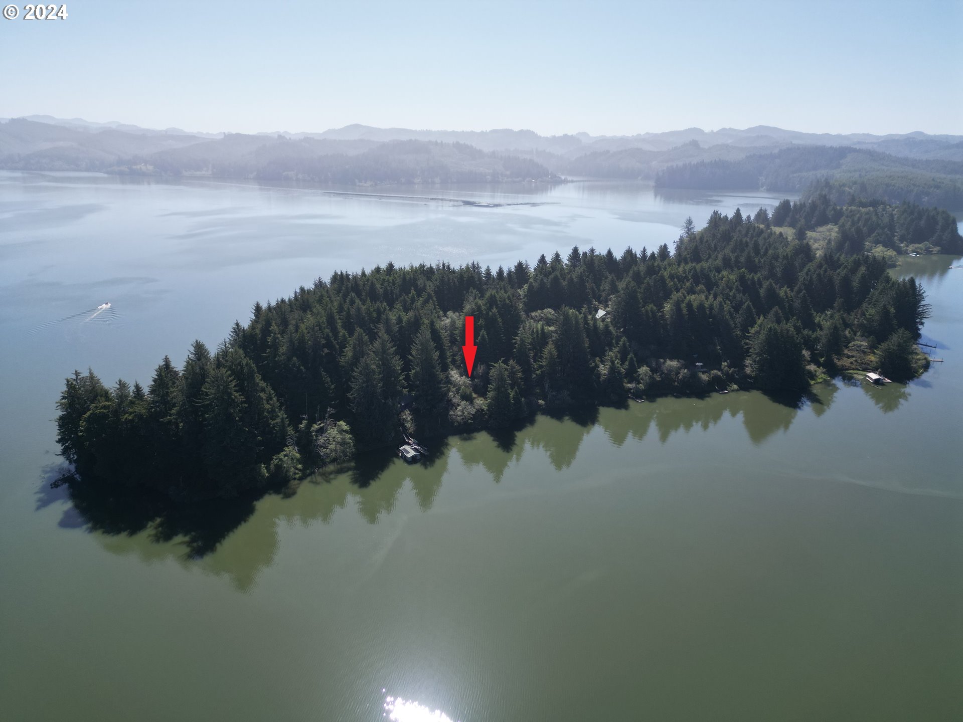 Booth Island Westlake, OR 97493 - Photo 1 of 11 a view of a lake and a mountain