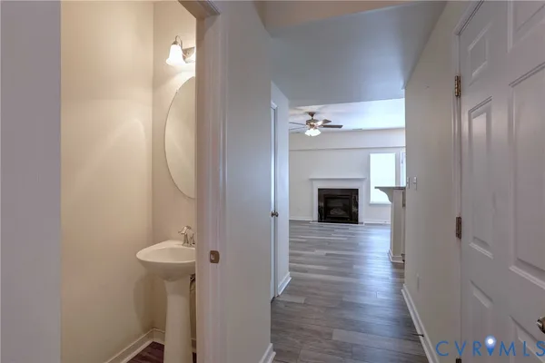a view of a hallway view with wooden floor and staircase