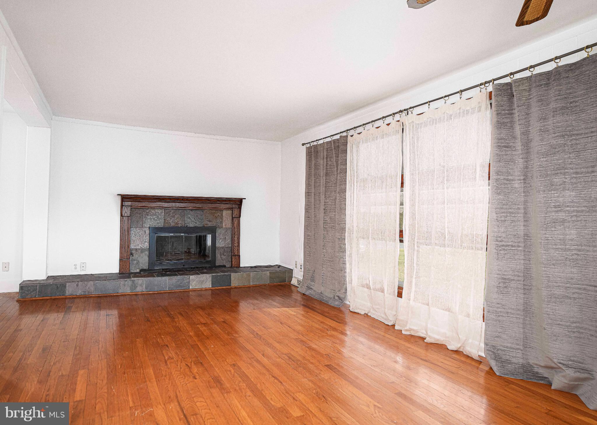 518 Paradise Road Aberdeen, MD 21001 - Photo 5 of 37 Spacious living area with elegant fireplace.