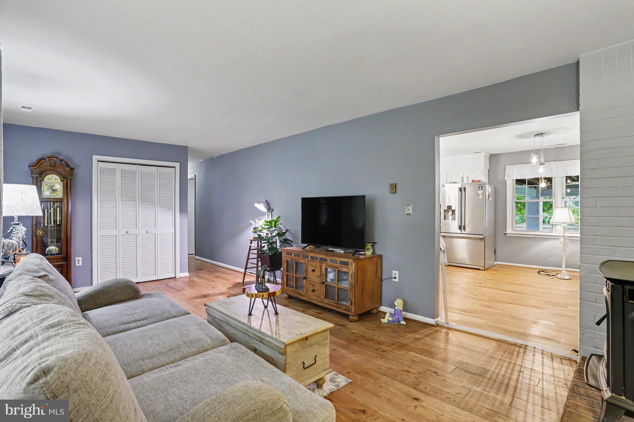 2226 Harney Road Littlestown, PA 17340 - Photo 14 of 40 a living room with furniture and a flat screen tv