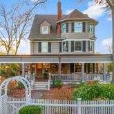 a view of a brick house with a large window