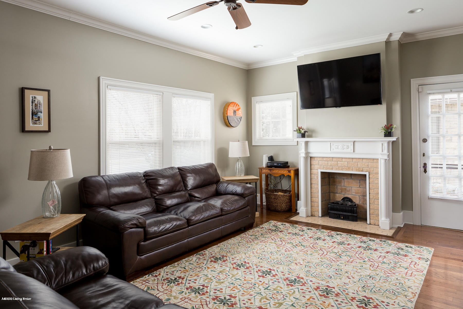 2413 Broadmeade Road Louisville, KY 40205 - Photo 6 of 50 Living Room with wood flooring, fireplace, and an abundant of natural light.