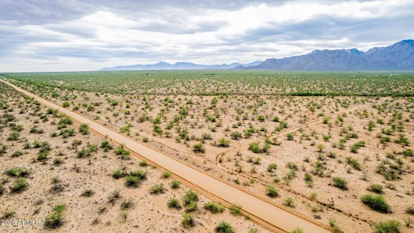 a sunset view with a yard