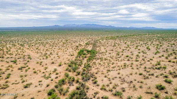 a view of a large body of water with a building in the background