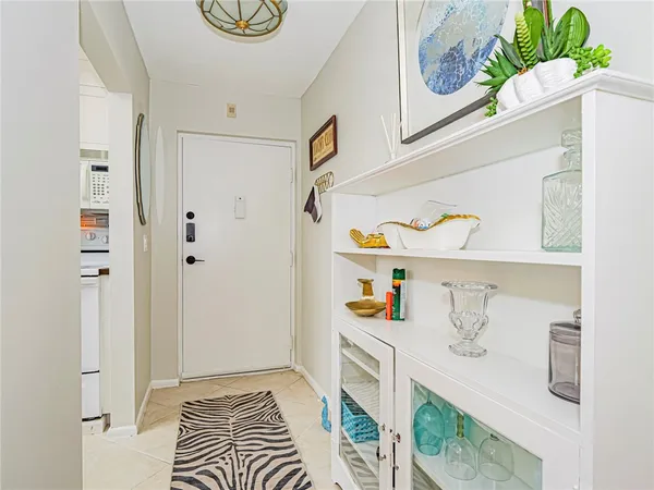 a kitchen with stainless steel appliances granite countertop a sink a stove and cabinets