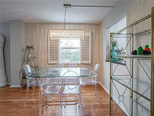 a view of a livingroom with furniture and a window