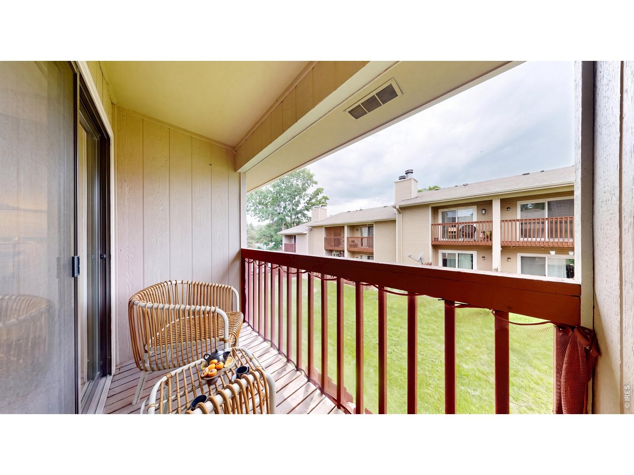 1440 Edora Road, Unit 19 Fort Collins, CO 80525 - Photo 15 of 30 Private balcony off the primary bedroom overlooks the green common space. (Virtually staged)