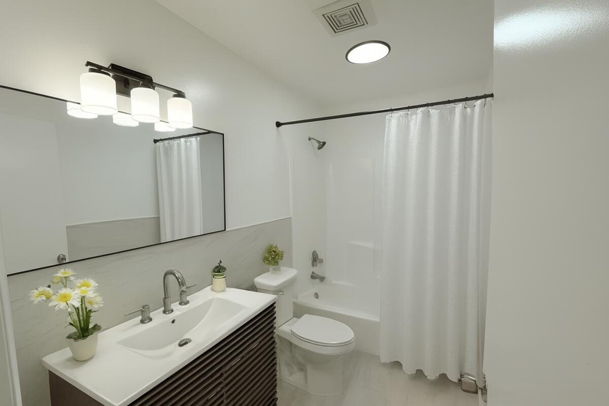 5231 Wallis Road, Unit C West Palm Beach, FL 33415 - Photo 8 of 8 a bathroom with a sink toilet and shower