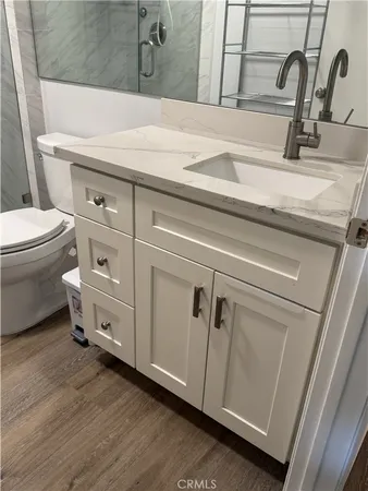 a bathroom with a toilet and a sink