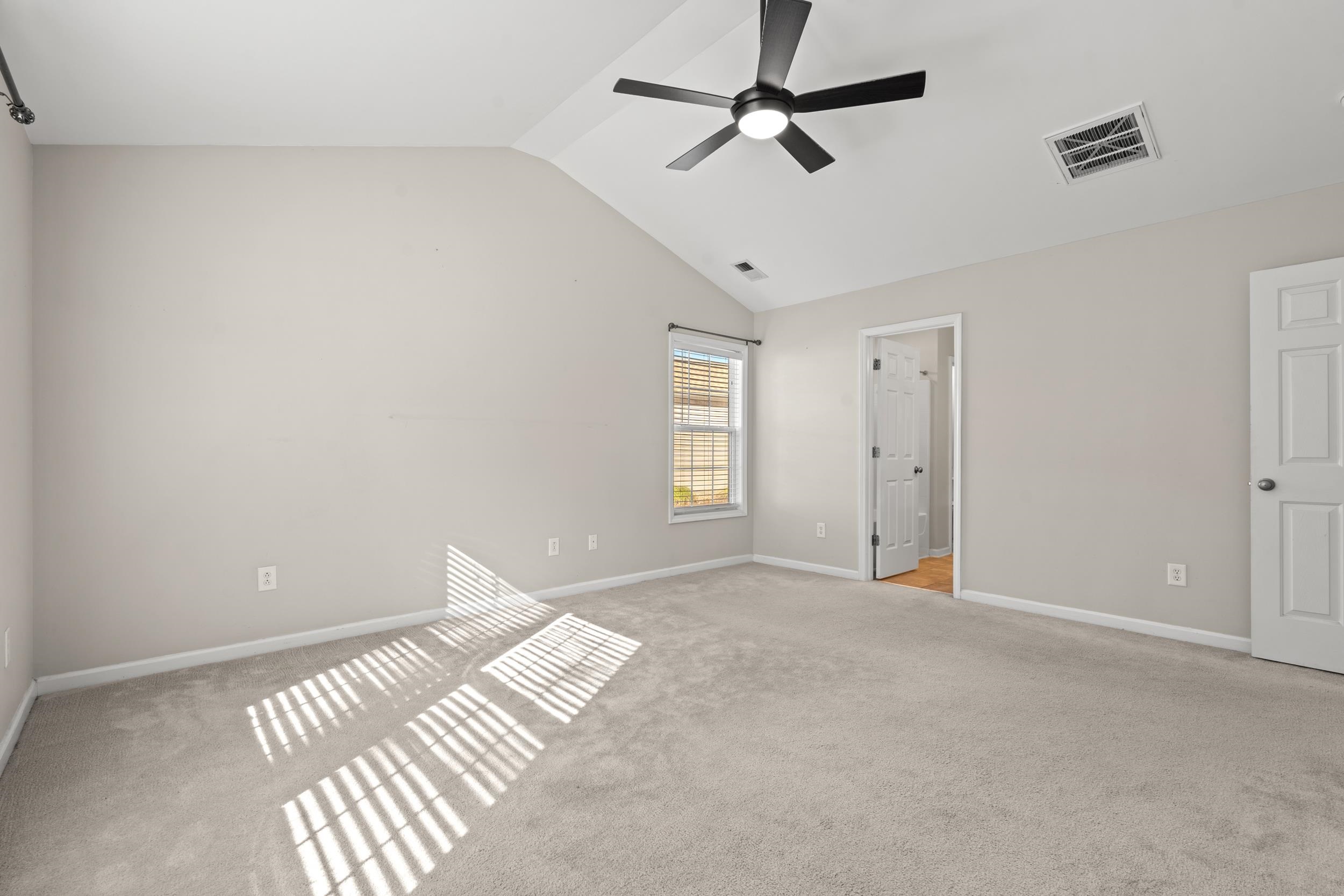 2487 Windmill Way Myrtle Beach, SC 29579 - Photo 19 of 40 Unfurnished bedroom featuring light colored carpet, lofted ceiling, and ceiling fan