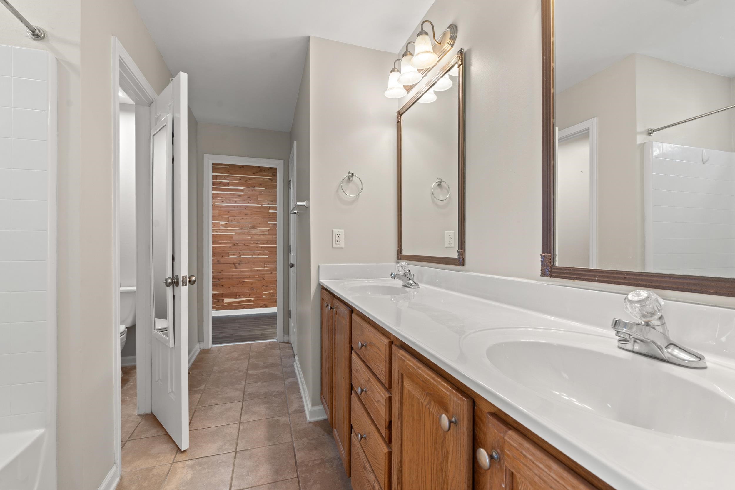 2487 Windmill Way Myrtle Beach, SC 29579 - Photo 22 of 40 Full bath featuring double vanity and light tile patterned flooring
