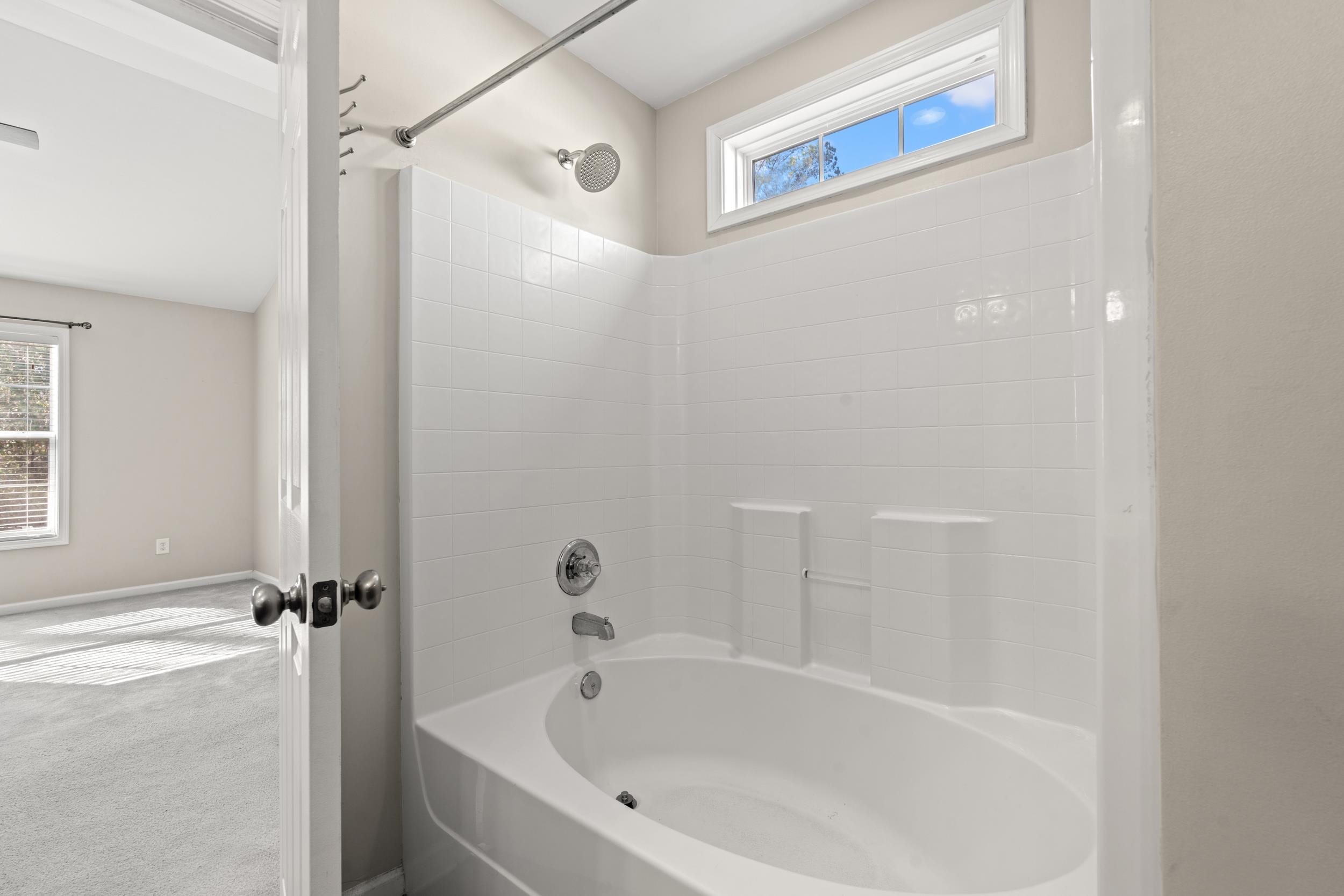 2487 Windmill Way Myrtle Beach, SC 29579 - Photo 23 of 40 Bathroom featuring healthy amount of natural light, carpet, and bathtub / shower combination