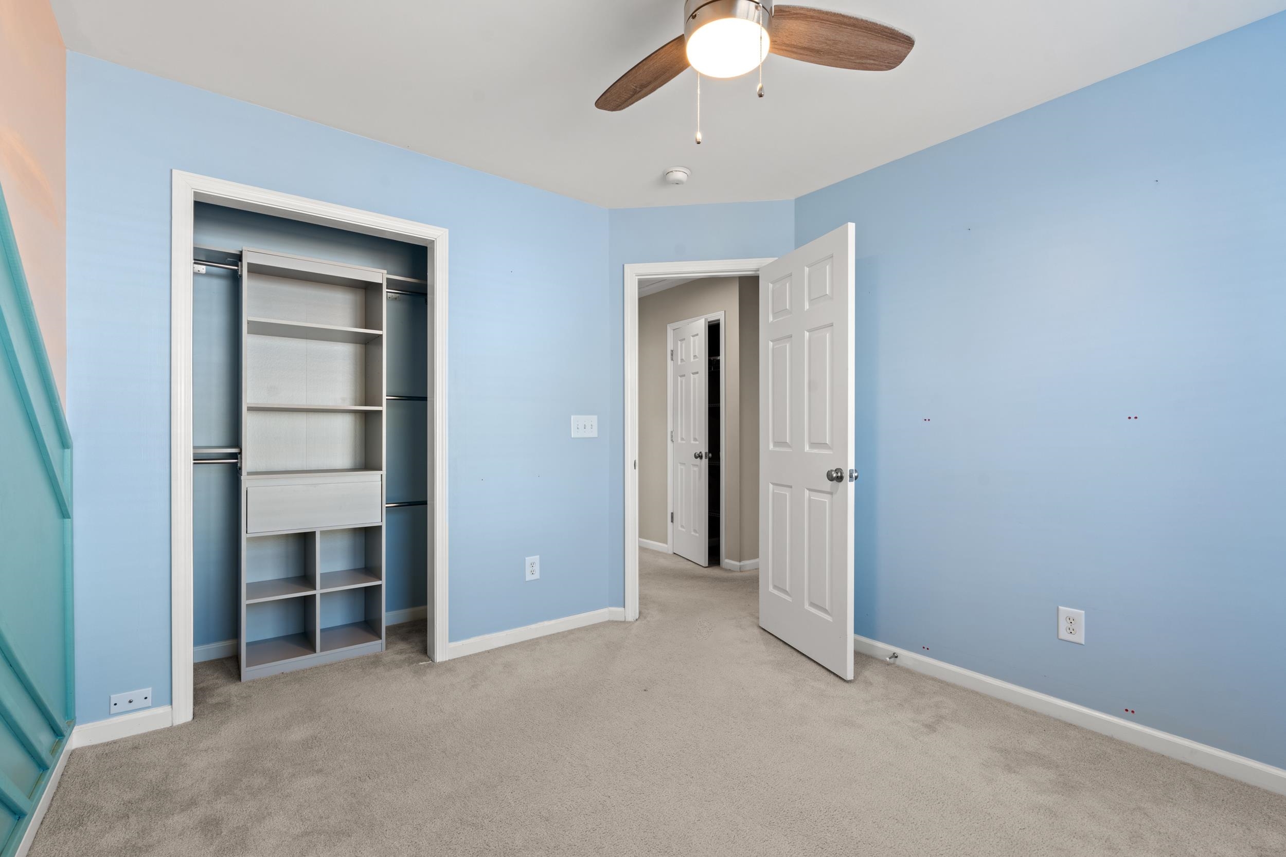 2487 Windmill Way Myrtle Beach, SC 29579 - Photo 28 of 40 Unfurnished bedroom featuring carpet, a ceiling fan, and a closet