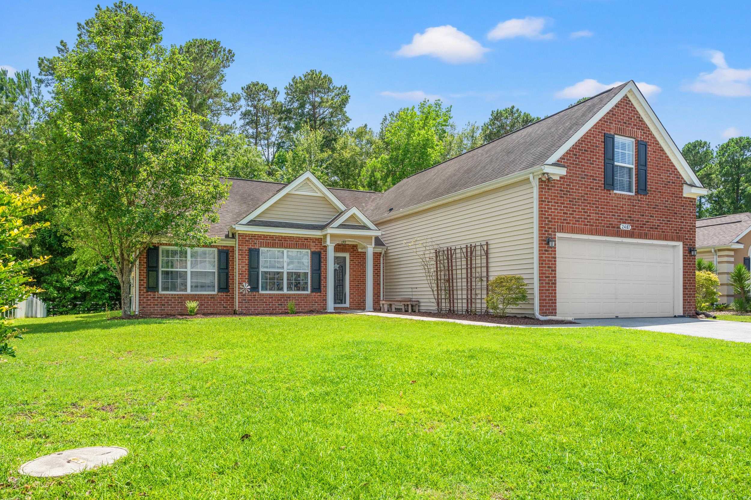 2487 Windmill Way Myrtle Beach, SC 29579 - Photo 3 of 40 View of front of house with a front lawn, driveway, and roof with shingles