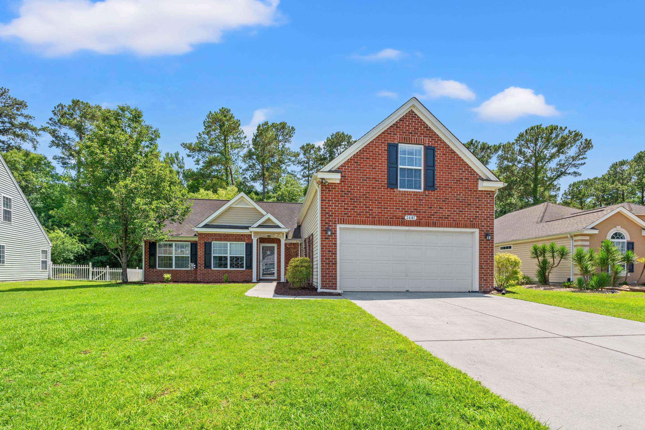 2487 Windmill Way Myrtle Beach, SC 29579 - Photo 6 of 40 View of front of home featuring brick siding and concrete driveway