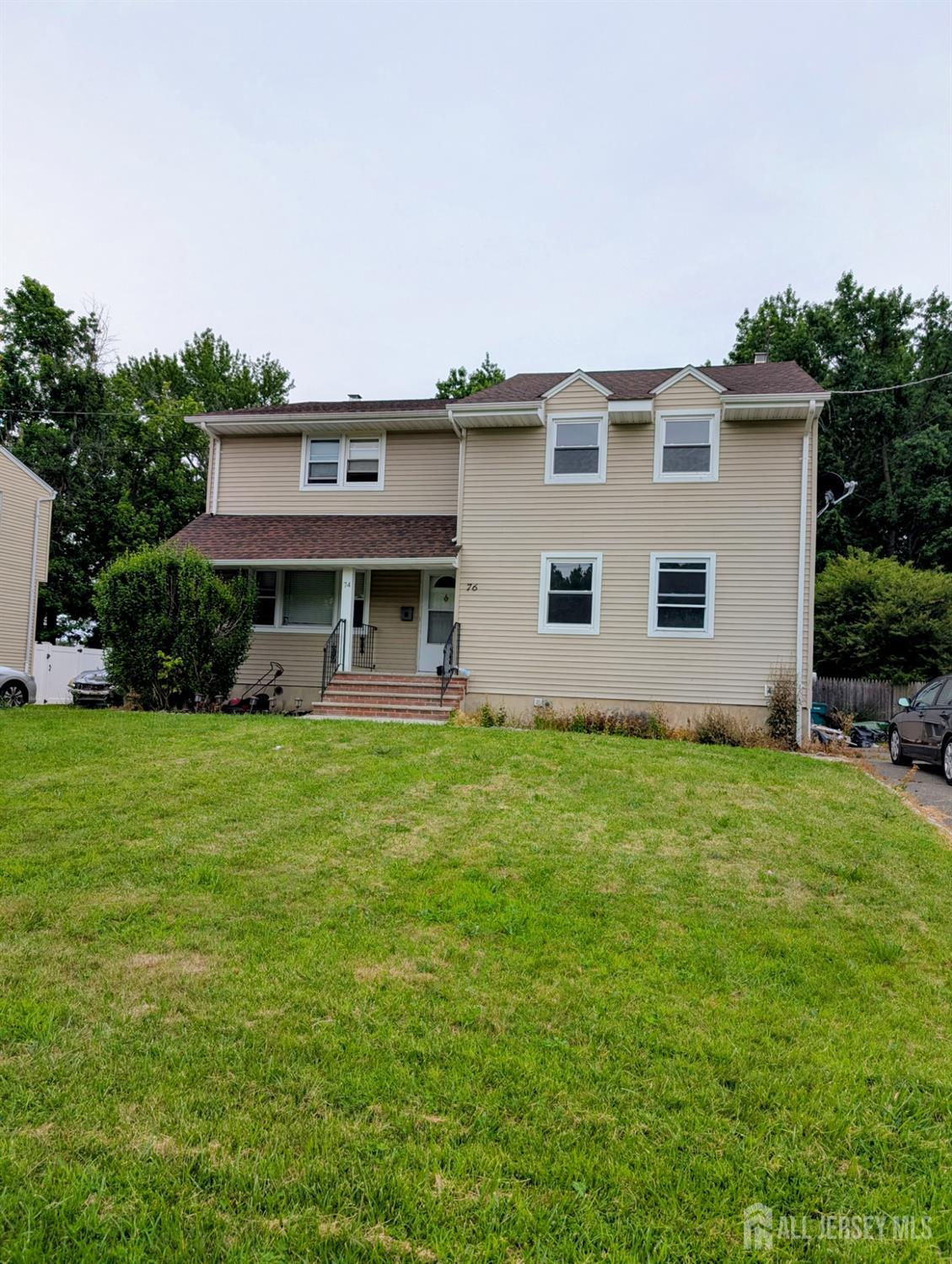 a front view of a house with garden