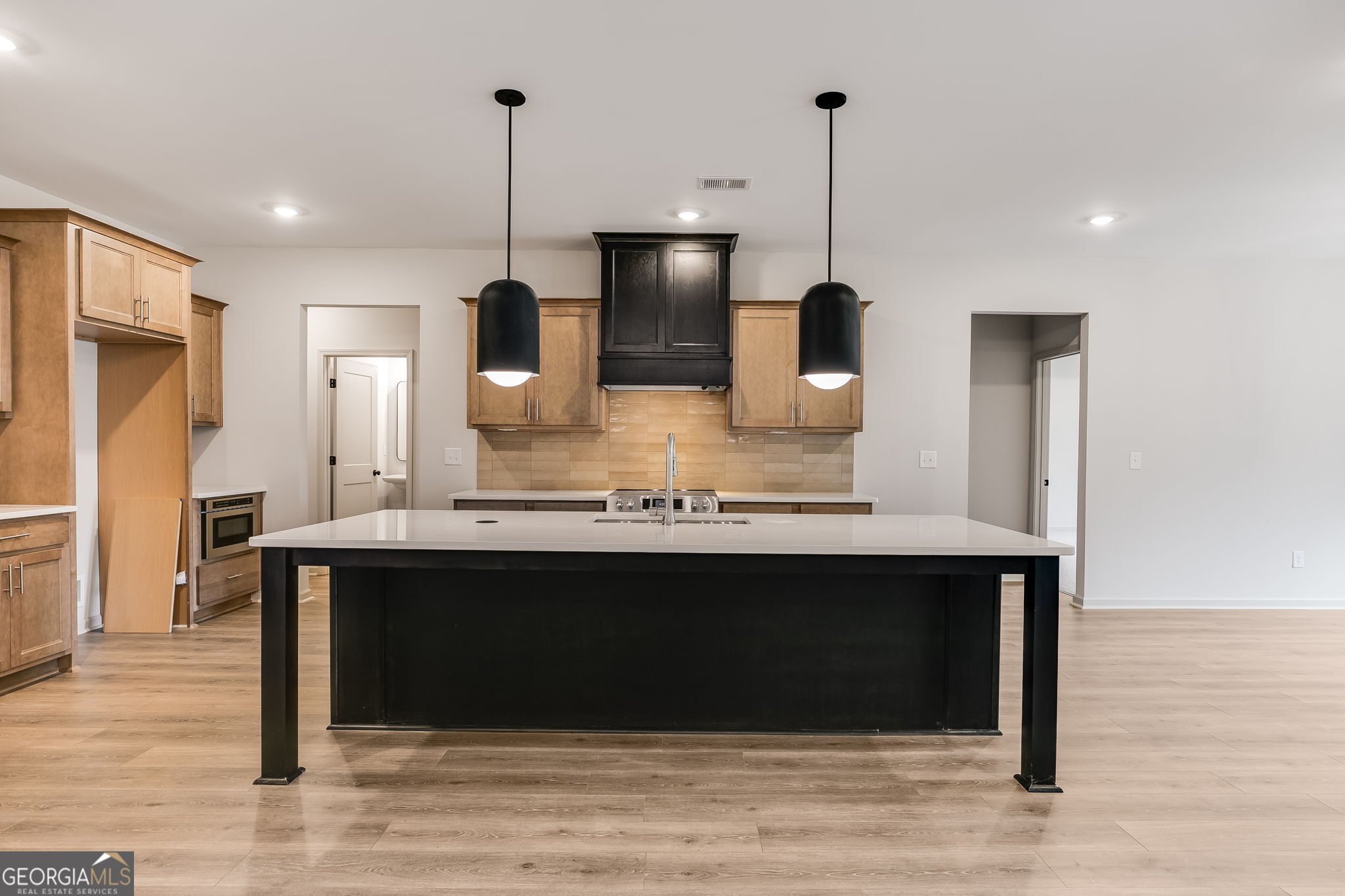 3262 Veal Road Roopville, GA 30170 - Photo 13 of 46 a kitchen with kitchen island white cabinets and stainless steel appliances