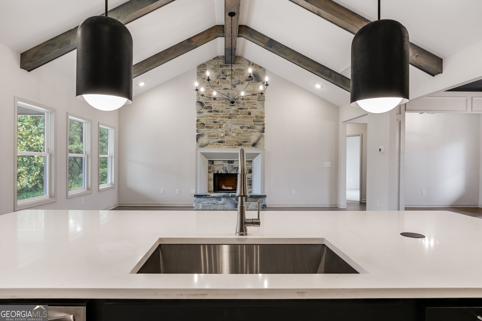 3262 Veal Road Roopville, GA 30170 - Photo 18 of 46 a view of kitchen with granite countertop a sink stainless steel appliances and a chandelier