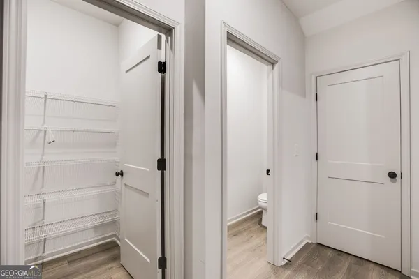a view of a livingroom with a ceiling fan and window