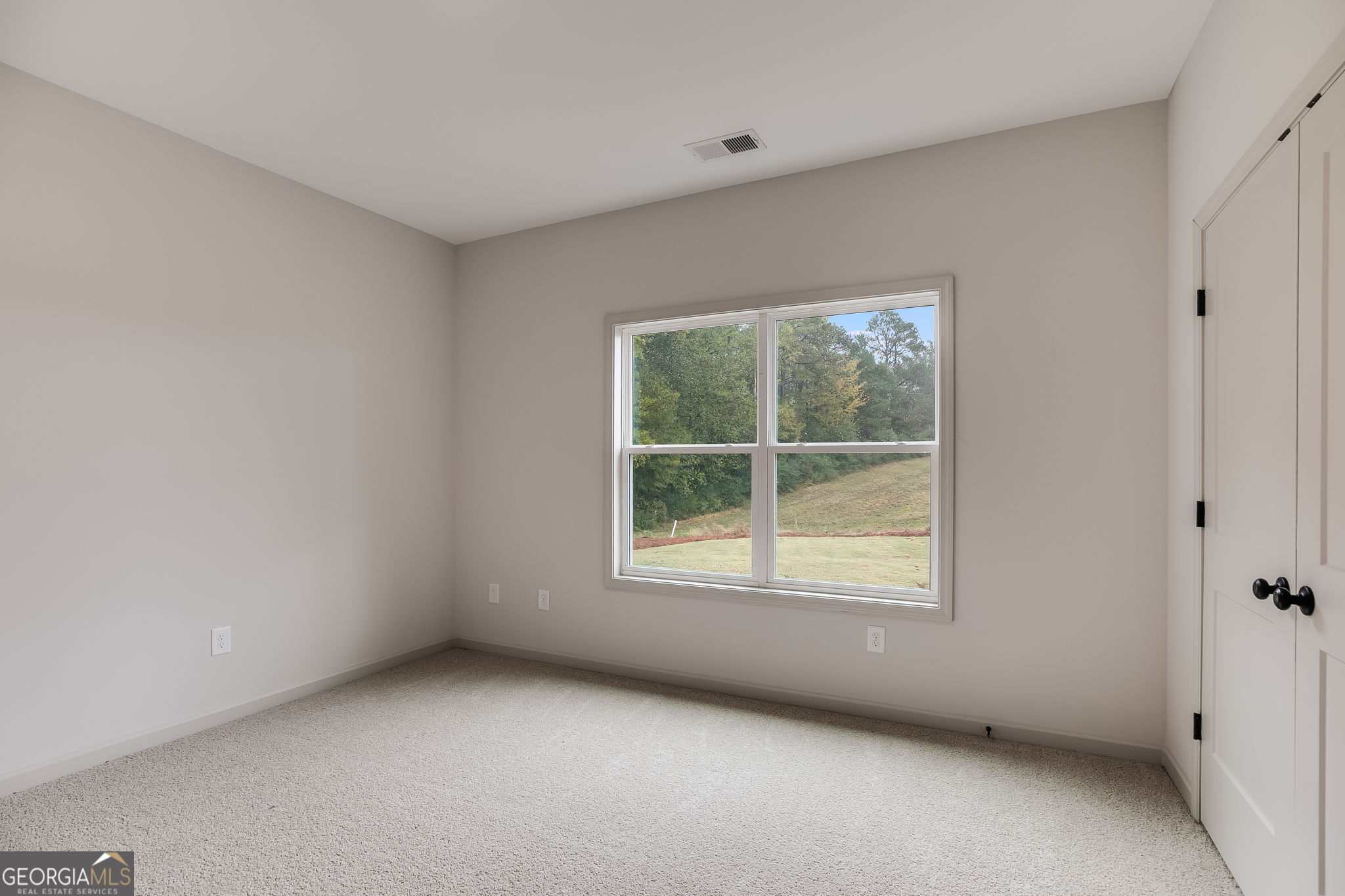 3262 Veal Road Roopville, GA 30170 - Photo 31 of 46 an empty room with a window