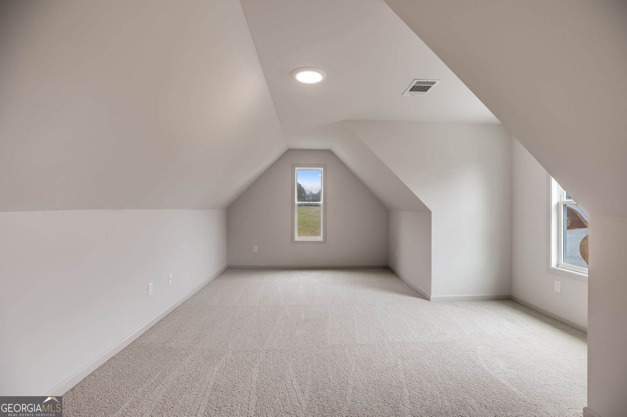 3262 Veal Road Roopville, GA 30170 - Photo 35 of 46 an empty room with windows and closet