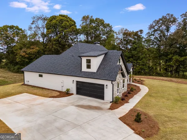 a backyard of a house with lots of green space