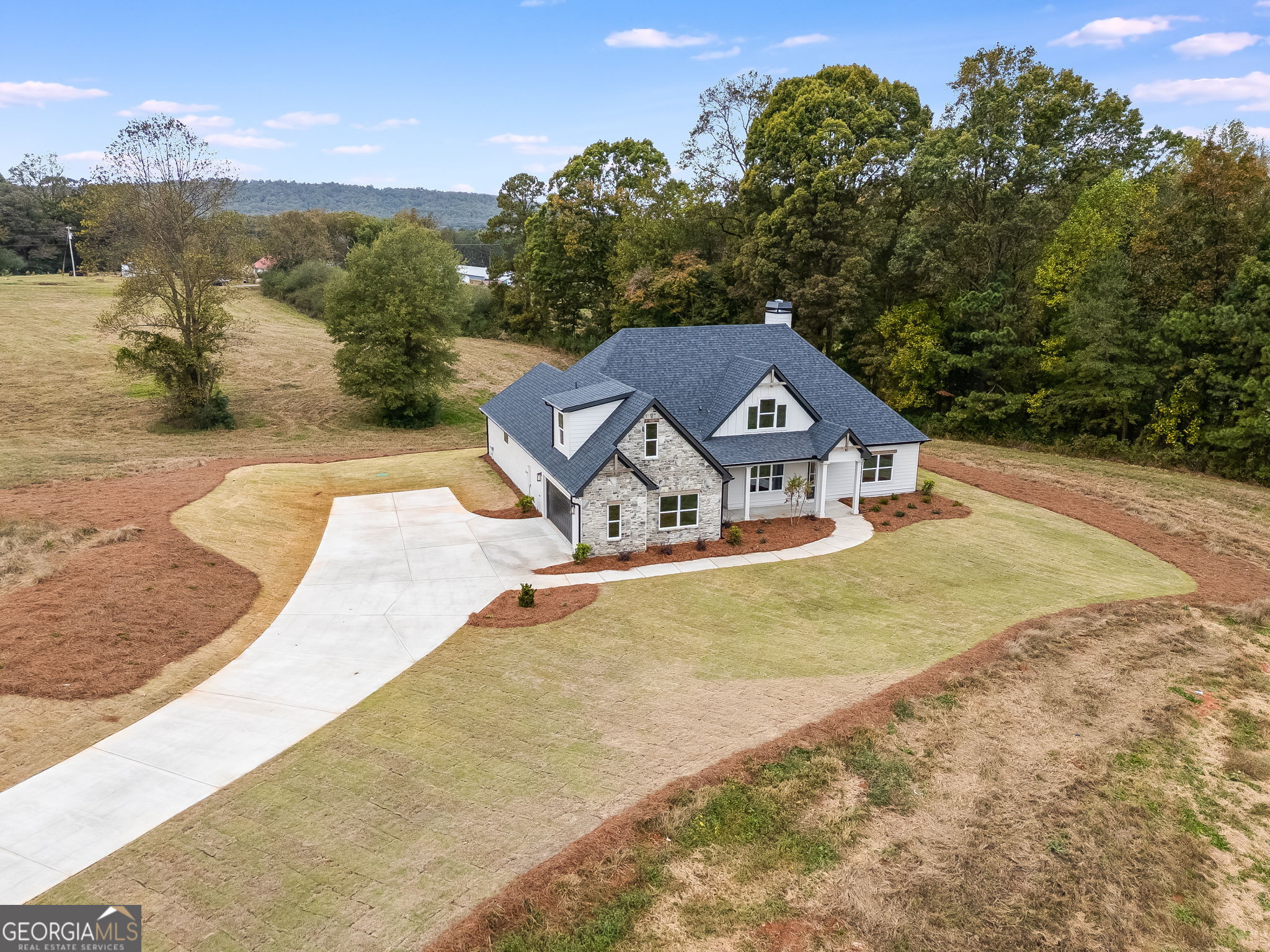 3262 Veal Road Roopville, GA 30170 - Photo 5 of 46 a house with trees in the background