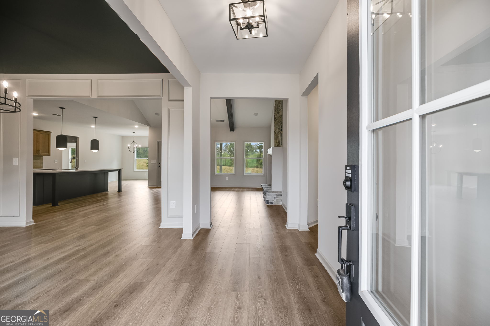 3262 Veal Road Roopville, GA 30170 - Photo 6 of 46 a view of a hallway view with wooden floor and a living room