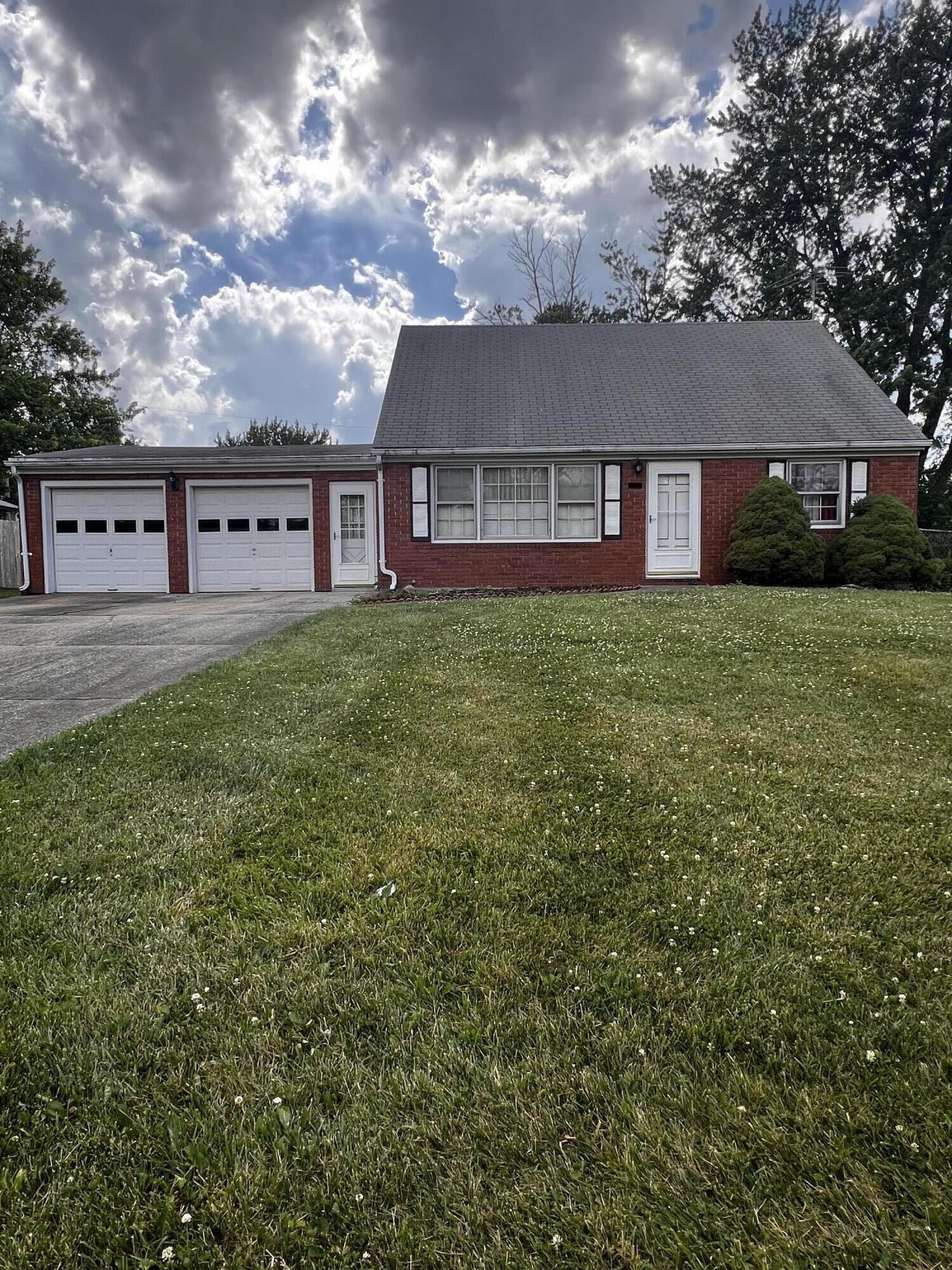 772 Imperial Road Valparaiso, IN 46385 - Photo 1 of 20 a view of a house next to a big yard and large tree