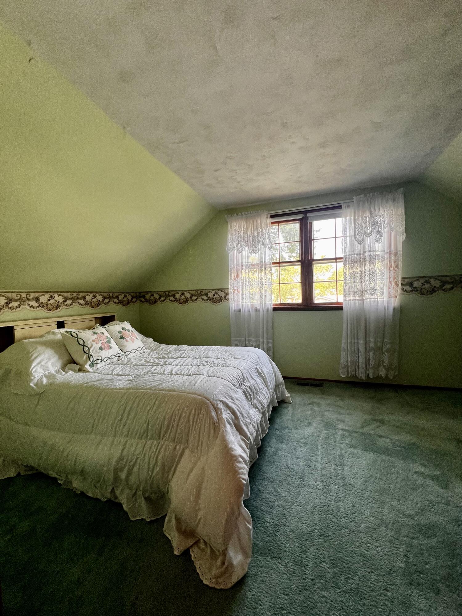 772 Imperial Road Valparaiso, IN 46385 - Photo 11 of 20 a bed sitting in a spacious bedroom next to a window and a larger closet