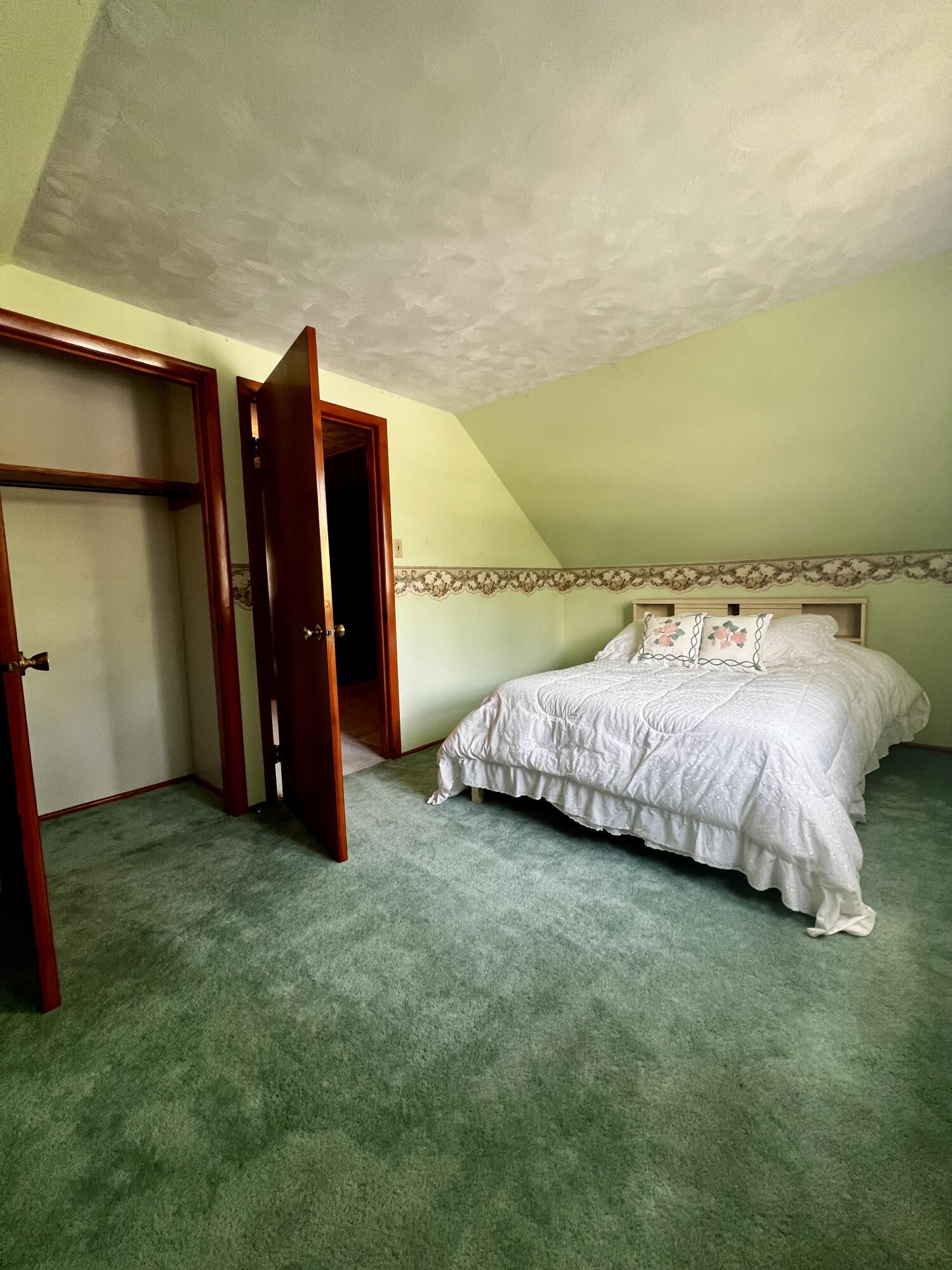 772 Imperial Road Valparaiso, IN 46385 - Photo 12 of 20 a bed and a chair sitting in a room