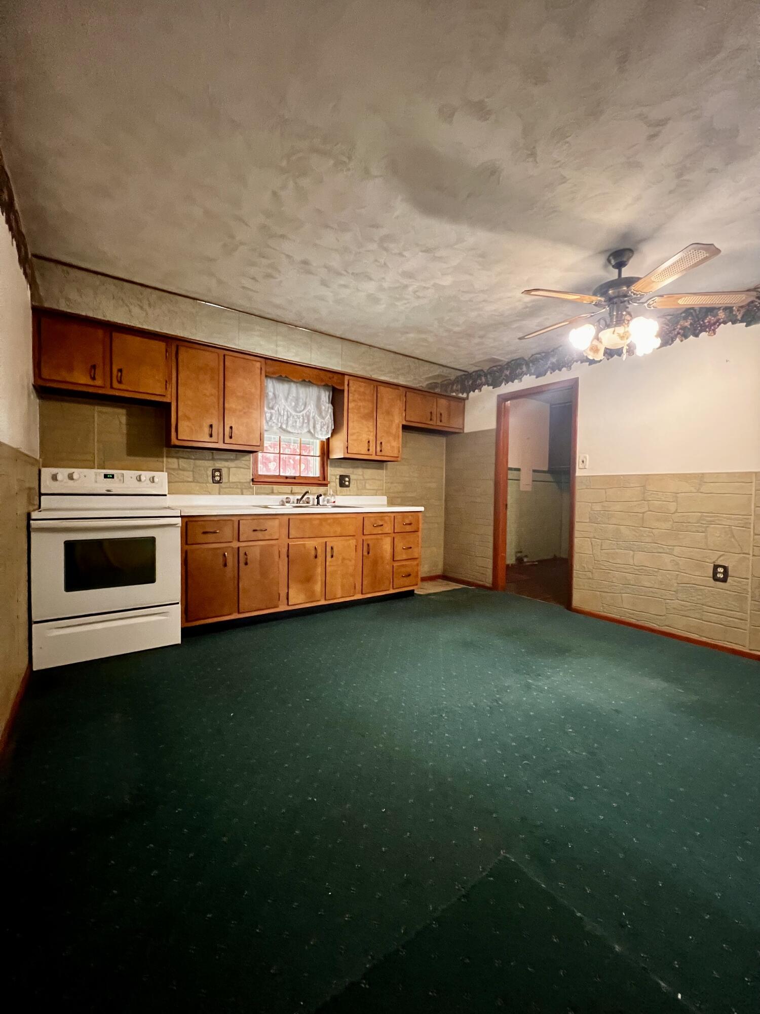 772 Imperial Road Valparaiso, IN 46385 - Photo 4 of 20 a kitchen with granite countertop a stove and a sink