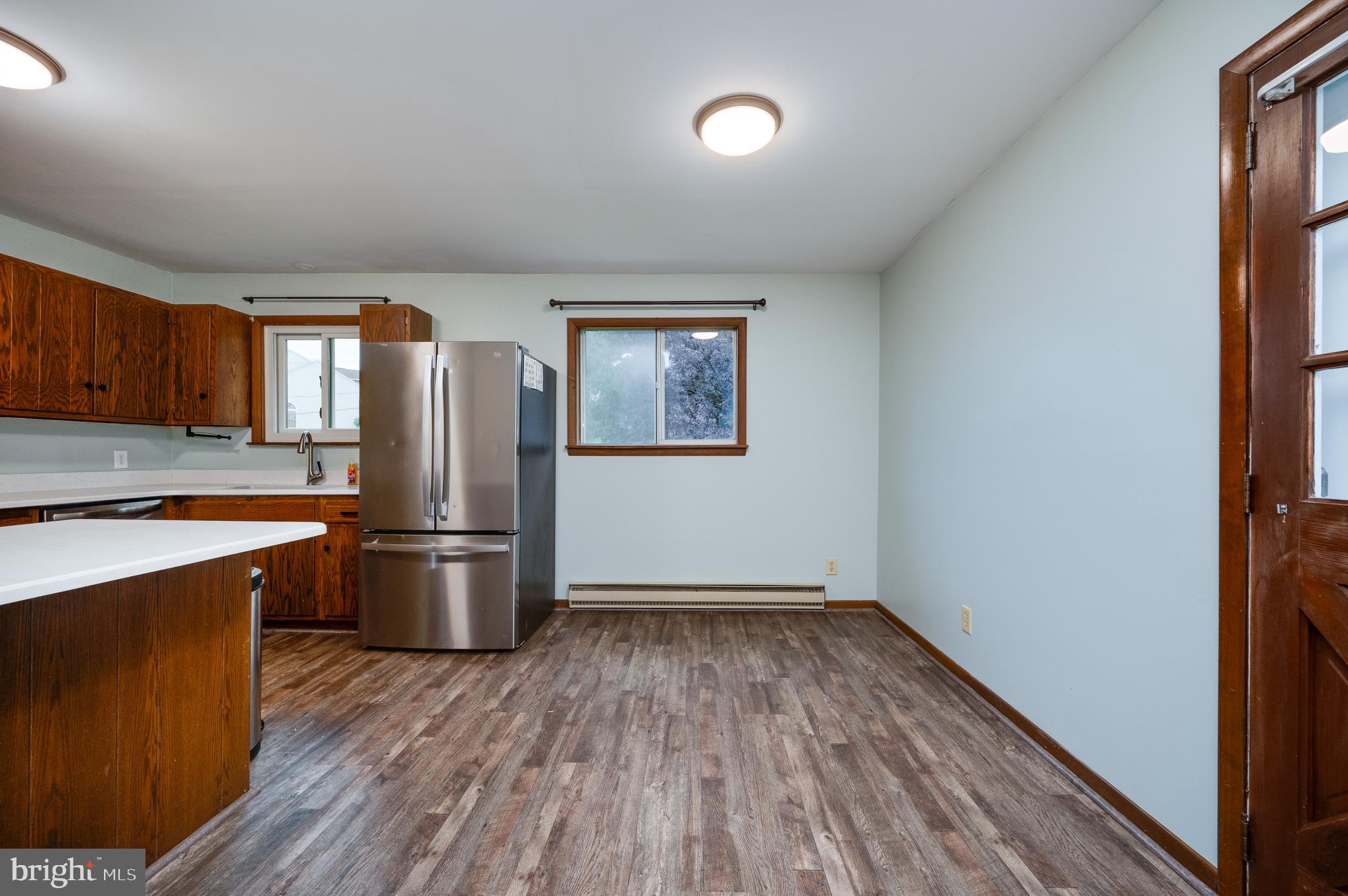 1029 Crestview Avenue Reading, PA 19607 - Photo 15 of 44 a kitchen with wooden floor and stainless steel appliances
